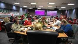 volunteers answering phones during the annual NORAD Tracks Santa event