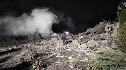 Ukrainian firefighters work at damaged hospital