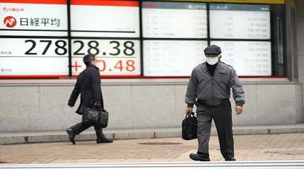 monitors showing Japan's Nikkei 225 index