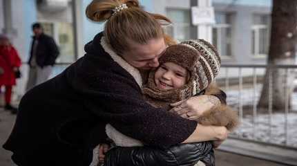 Halyna hugs her daughter Arina