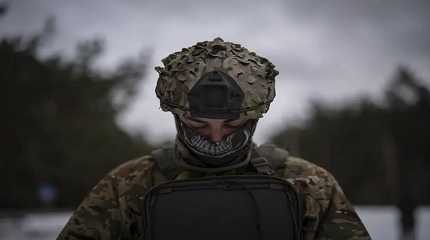 Ukrainian serviceman controls a drone