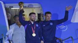 Lionel Messi holds the FIFA World Cup trophy
