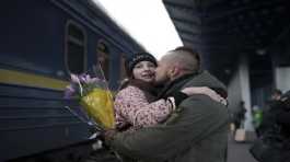 Ukrainian soldier Vasyl Khomko hugs his daughter