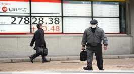 monitors showing Japan's Nikkei 225 index