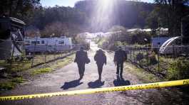 FBI officials walk the crime scene