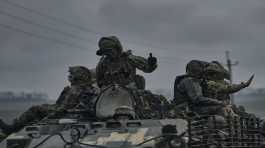 Ukrainian servicemen ride